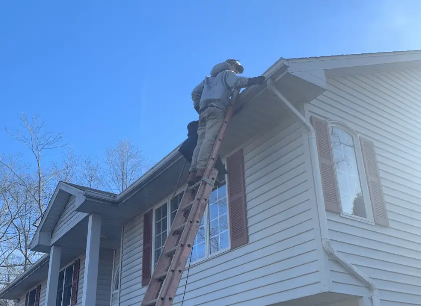 Gutter cleaning and maintenance being performed by University Heights Power Washing in University Heights